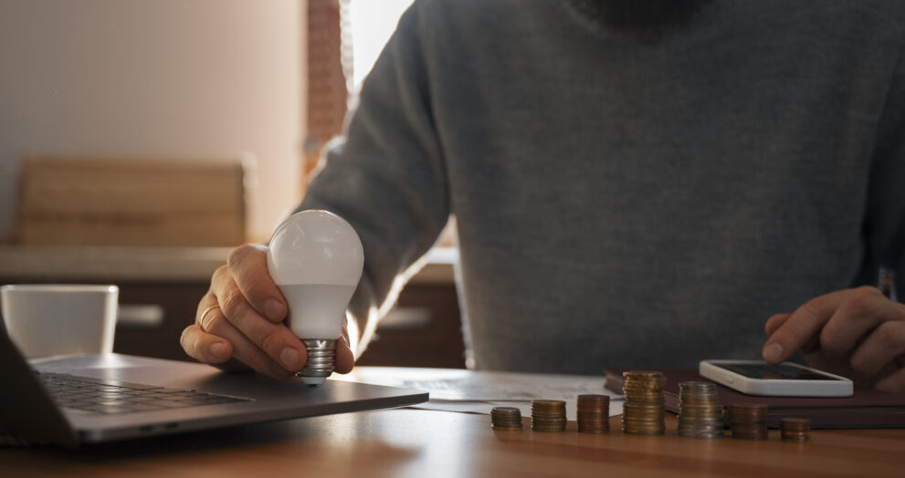 man saving money energy crisis