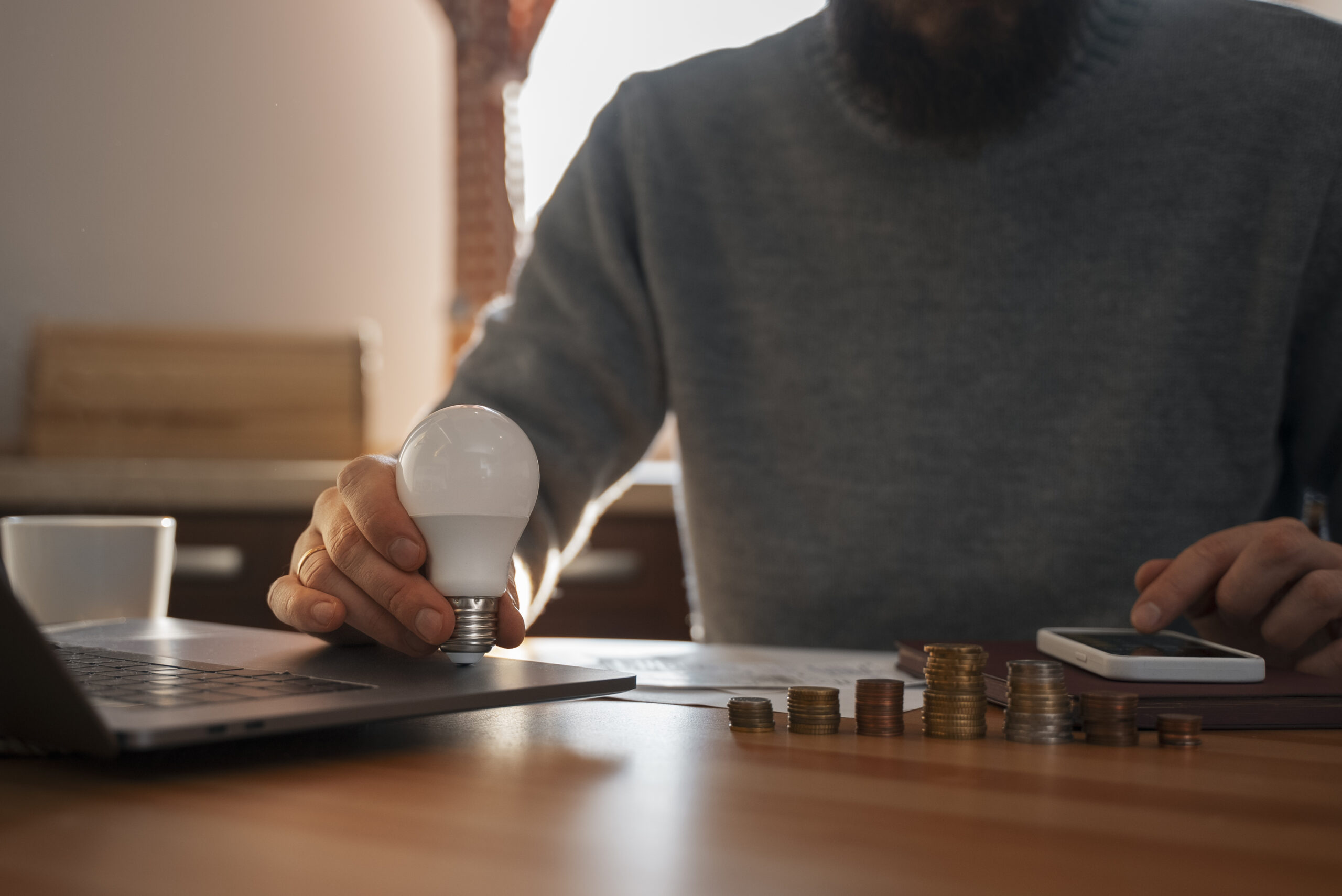 man saving money energy crisis scaled