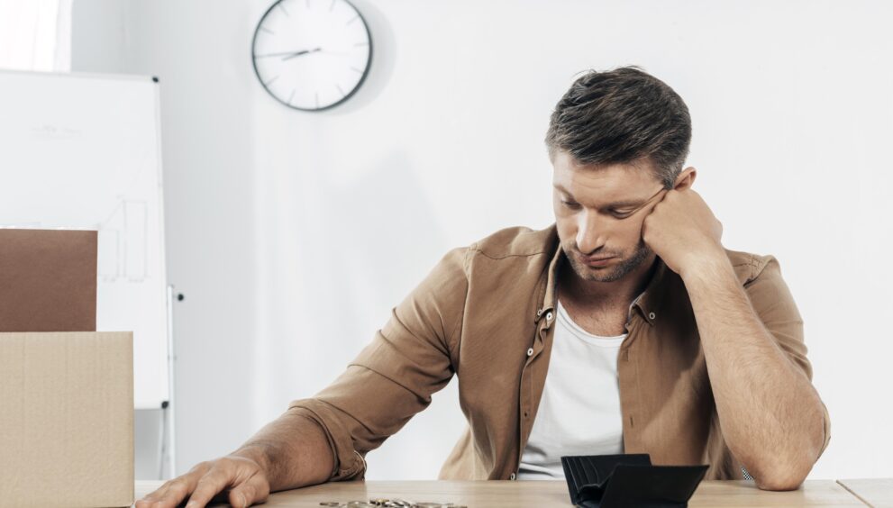 medium shot tired man with coins