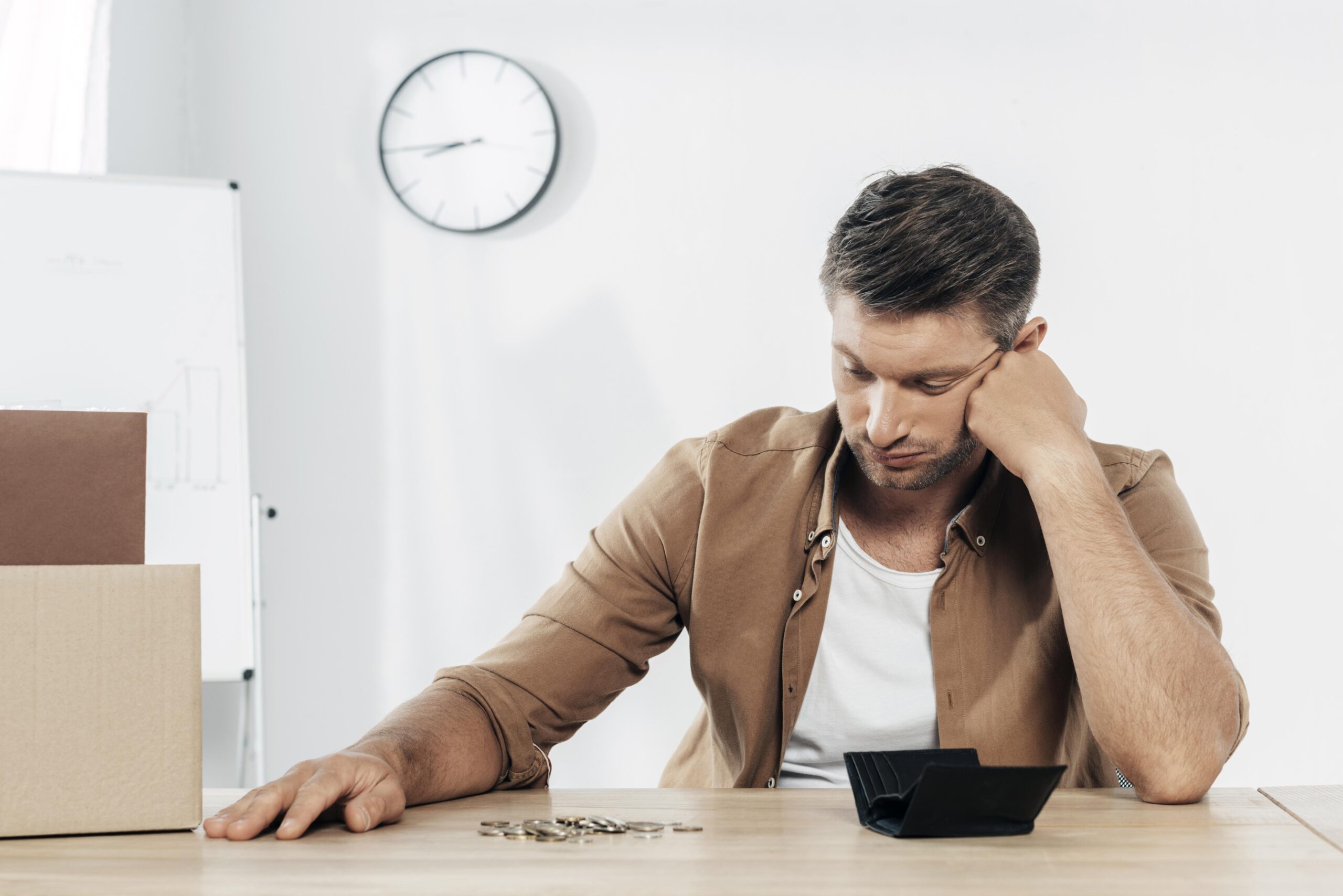 medium shot tired man with coins scaled