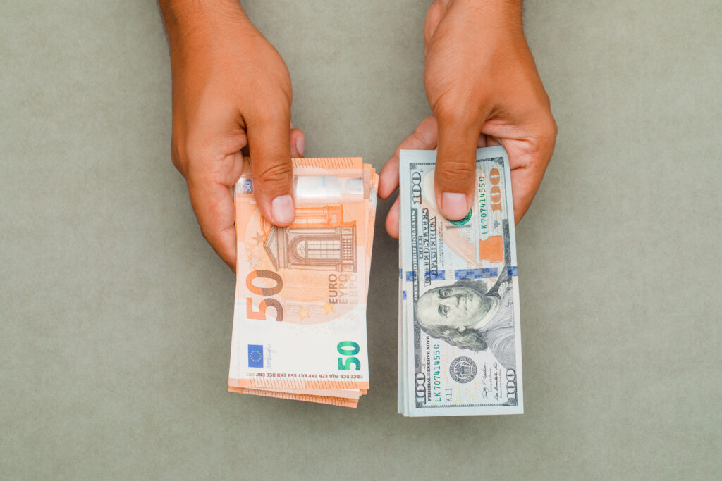 hands holding dollars euros