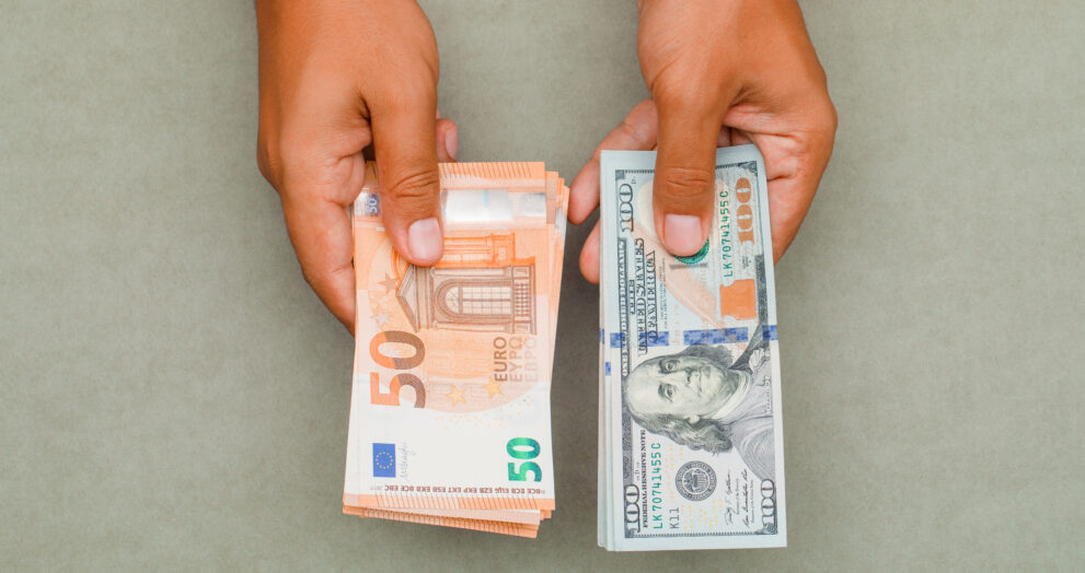 hands holding dollars euros