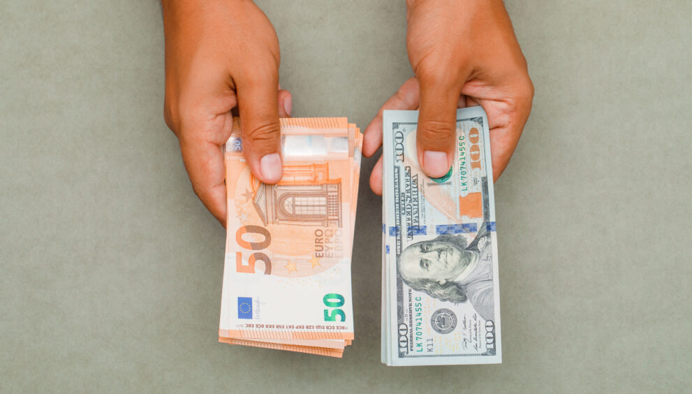 hands holding dollars euros