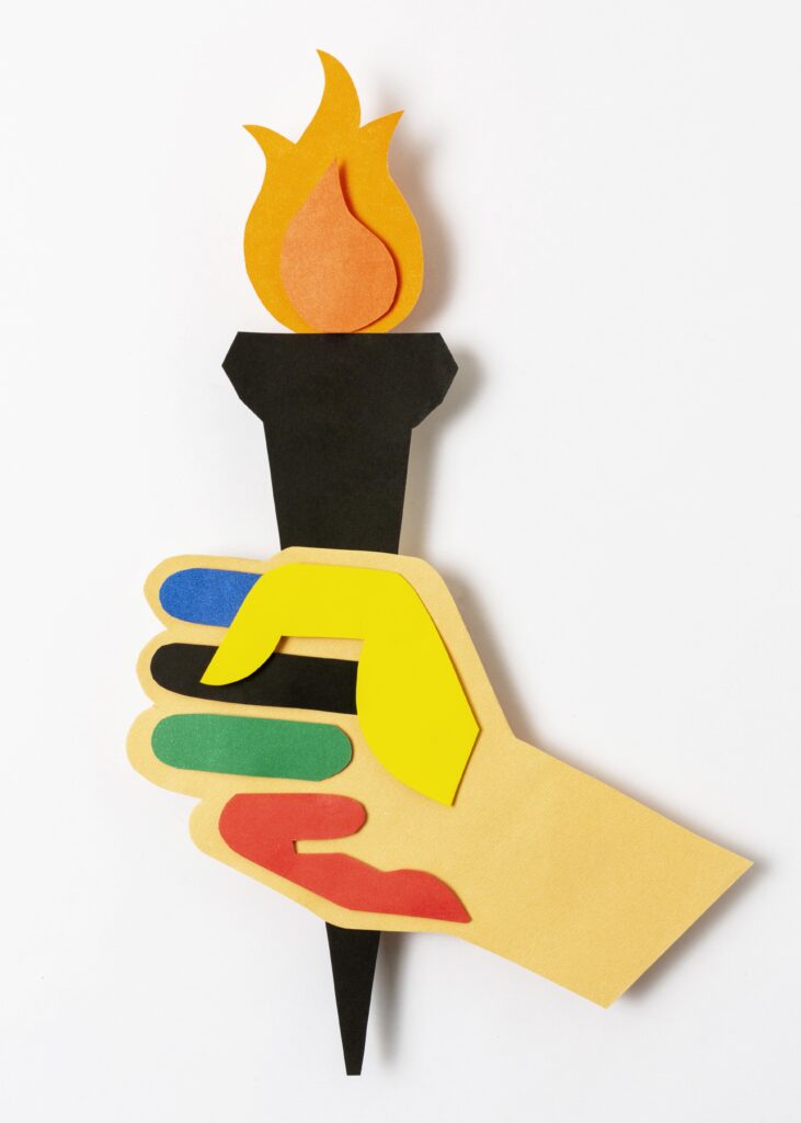 paper hand holding torch